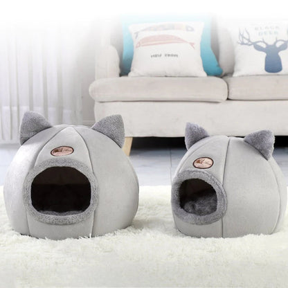 Pawfy Land cat cave beds in two sizes on rug, soft grey enclosed pet house