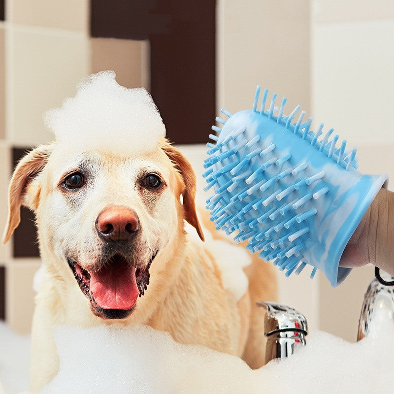 Close view of blue bristle paw cleaner used during dog bath with foam.
