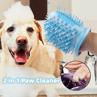 Golden dog in bath foam while a blue silicone bristle glove cleans paws.