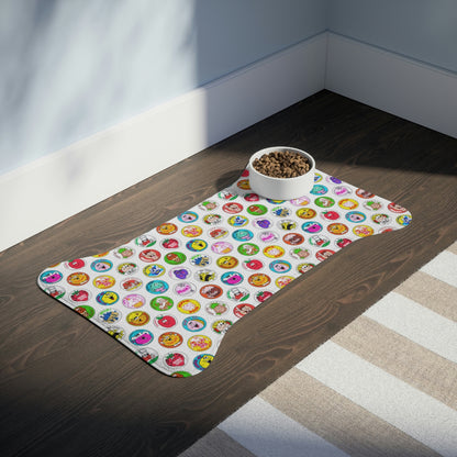 Bone-shaped pet placemat on dark wood floor with food bowl, colorful pattern.