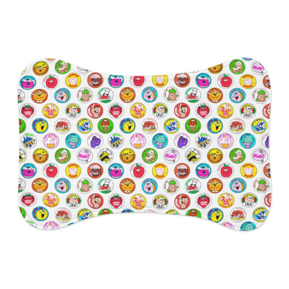 Bone-style non-slip feeding placemat for pets, colorful dots pattern, flat lay.